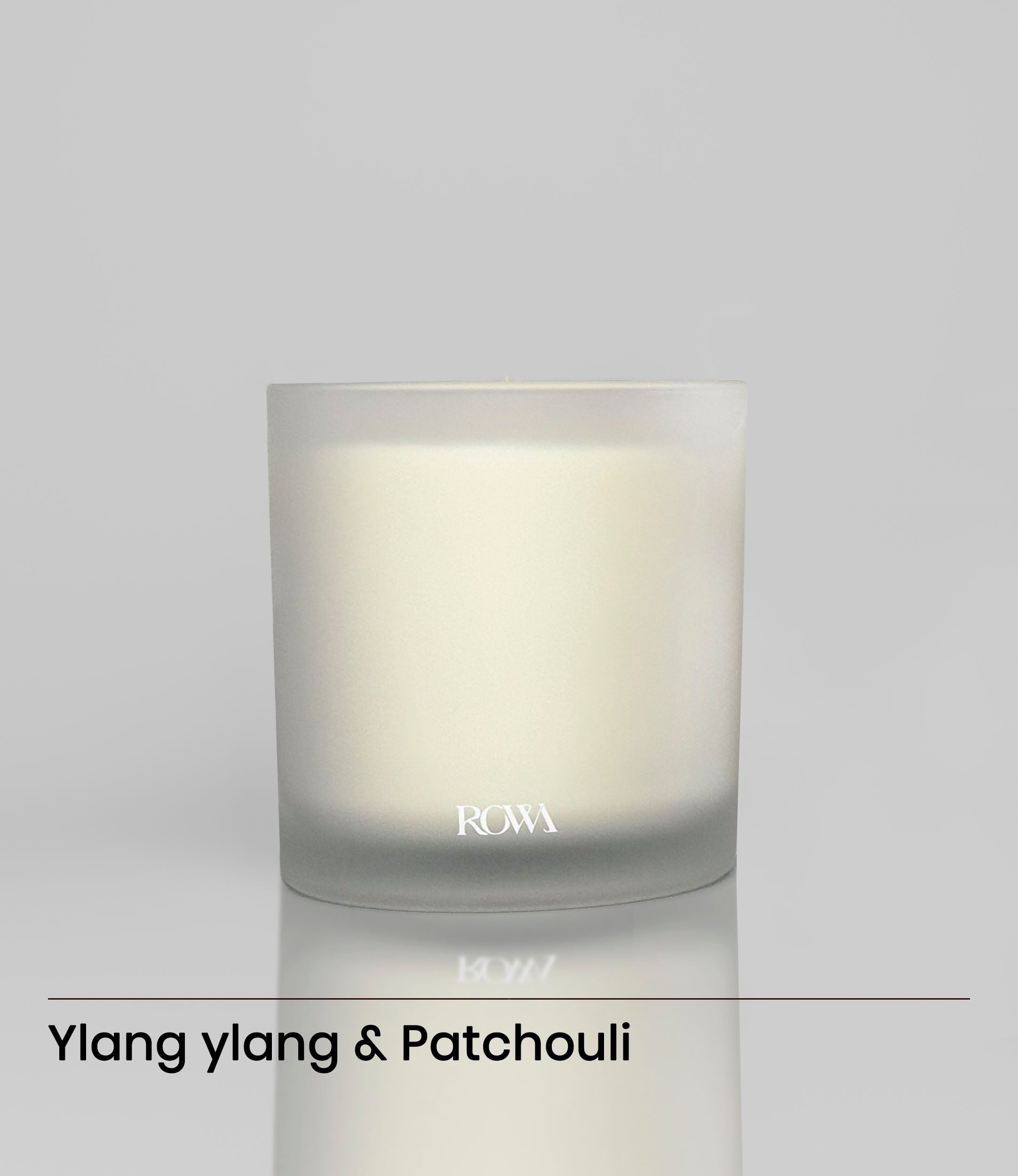 ROWA Frosted Bouquet candle in frosted glass, surrounded by chamomile and yellow florals, styled for a springtime ambiance.
